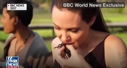 Angelina Jolie eating a tarantula